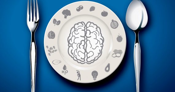 A plate with a picture of a brain on to represent linnk between brain and diet