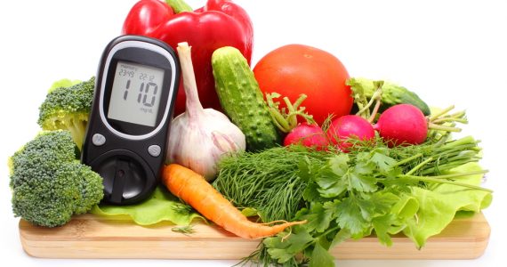 A diabetes blood glucose monitor among health vegetables