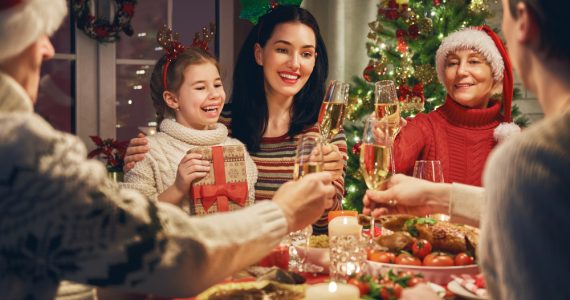 Christmas family scene eating Christmas dinner