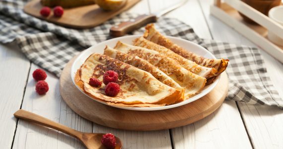 A plate of pancakes with berries