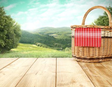 IMage of a picnic basket overlooking the countryside