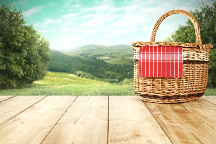 IMage of a picnic basket overlooking the countryside