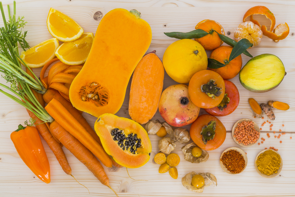 A range of orange fruits and vegetables